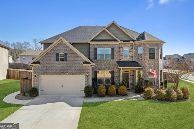 view of front of house with a garage and a front yard