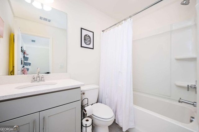 full bathroom featuring shower / bath combo, toilet, and vanity