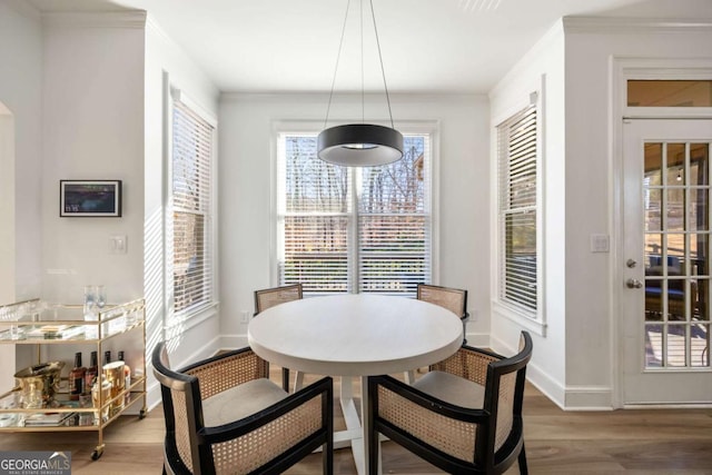 dining area with wood-type flooring