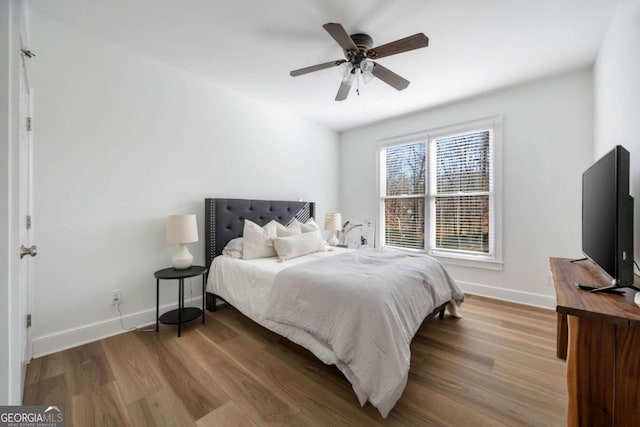 bedroom featuring ceiling fan and light hardwood / wood-style flooring