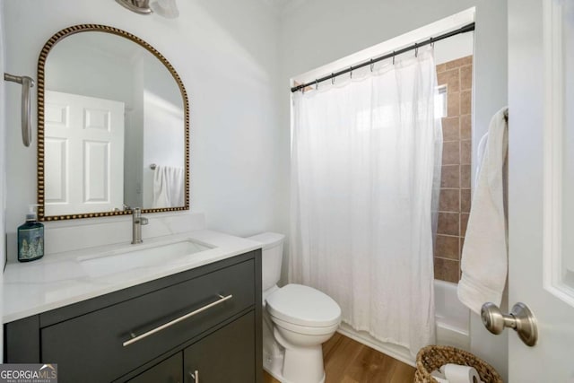 full bathroom featuring wood-type flooring, toilet, vanity, and shower / tub combo with curtain