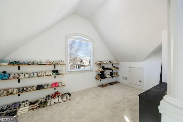 bonus room featuring carpet flooring and vaulted ceiling