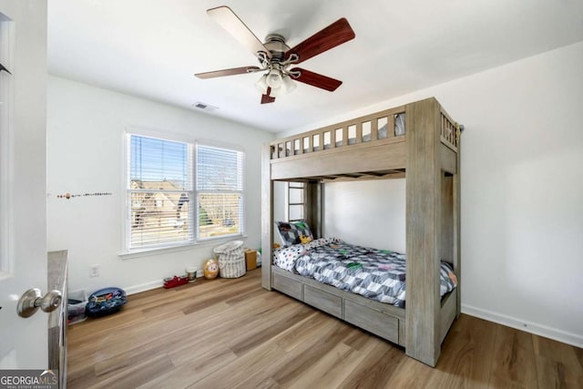 bedroom featuring ceiling fan and hardwood / wood-style flooring