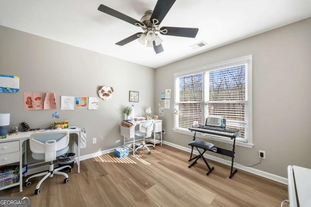 office area featuring light wood-type flooring and ceiling fan