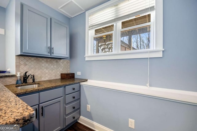 kitchen featuring sink and decorative backsplash