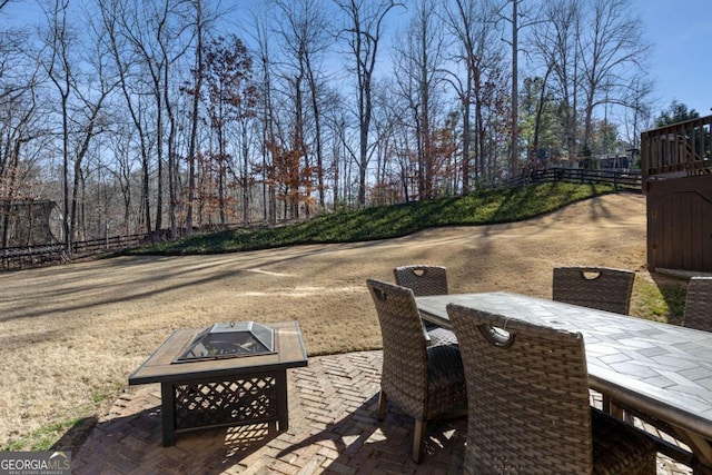 view of patio with an outdoor fire pit