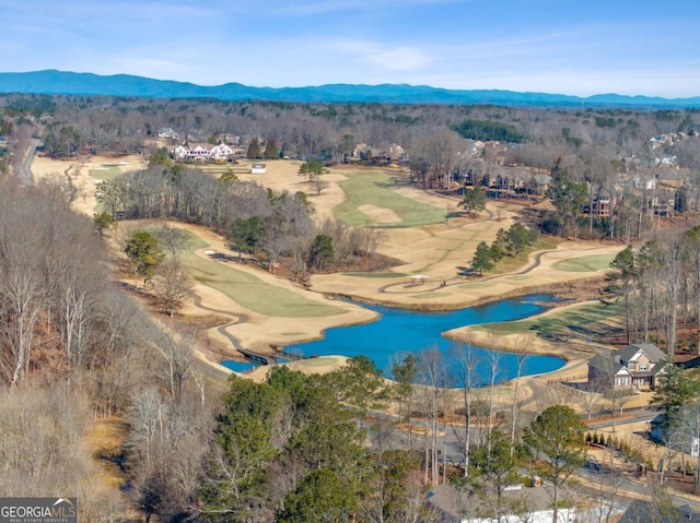 birds eye view of property featuring a water and mountain view