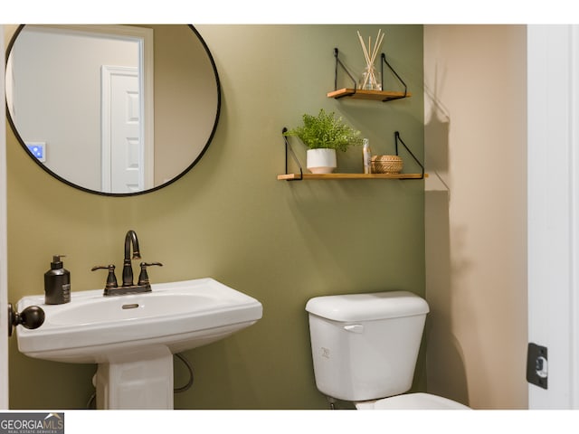 bathroom with sink and toilet