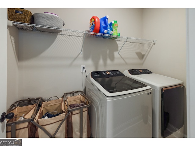 laundry room with washer and clothes dryer