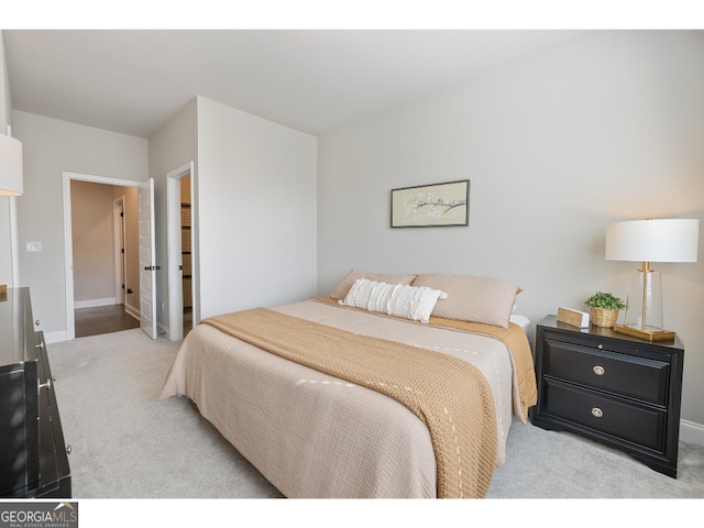 bedroom featuring light carpet