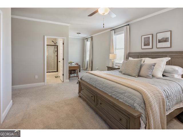 bedroom featuring ceiling fan, light colored carpet, crown molding, and ensuite bath