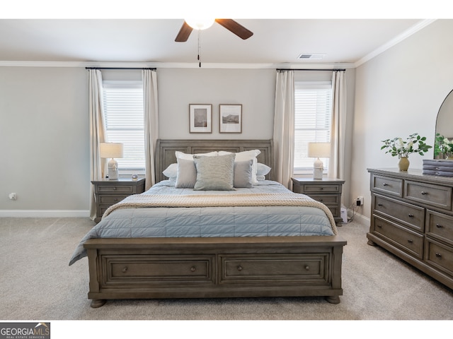 bedroom featuring light carpet, ceiling fan, and crown molding