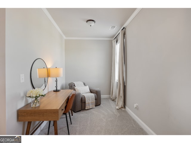 sitting room with ornamental molding and light carpet