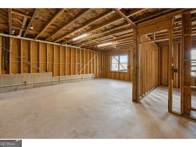 misc room with concrete flooring