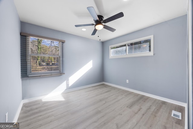 unfurnished room with ceiling fan and light hardwood / wood-style floors