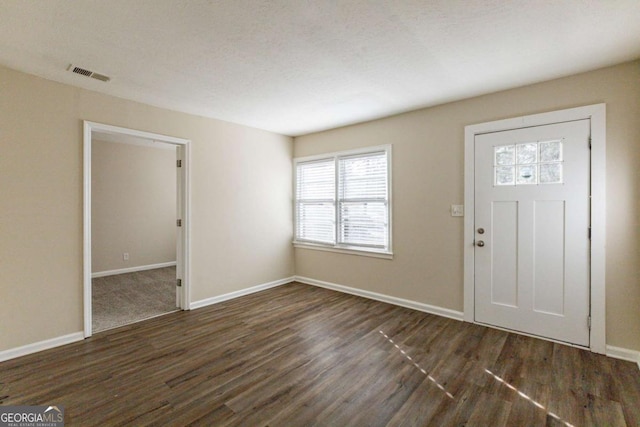 foyer entrance featuring dark hardwood / wood-style floors