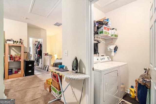 laundry room with separate washer and dryer and light colored carpet