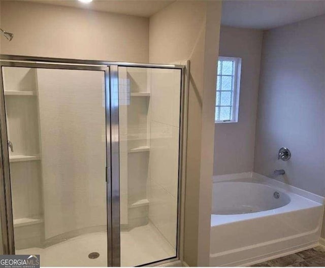 bathroom with independent shower and bath