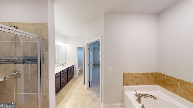 full bathroom with vanity, tile patterned floors, shower with separate bathtub, and toilet