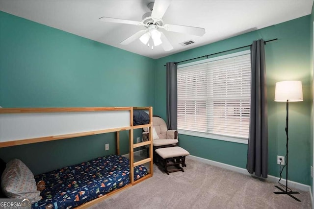 carpeted bedroom with ceiling fan