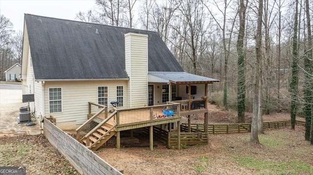 back of house featuring a wooden deck