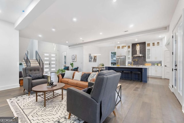 living room with light hardwood / wood-style flooring