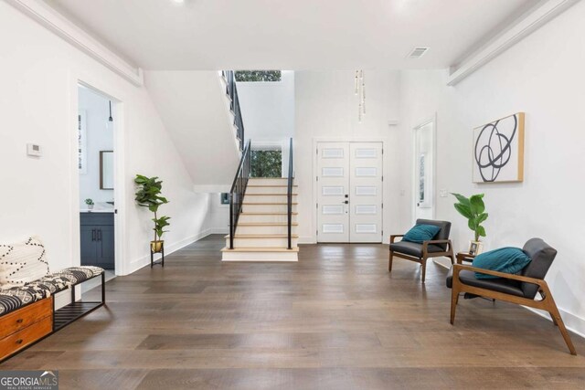 foyer with dark hardwood / wood-style flooring