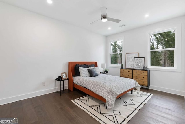 bedroom with ceiling fan and dark wood-type flooring