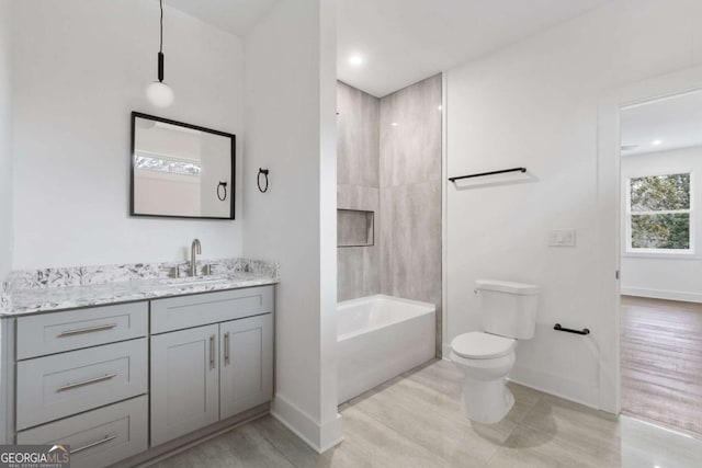 full bathroom with vanity, toilet, and shower / bathtub combination