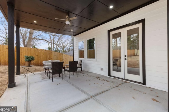 view of patio featuring ceiling fan and french doors