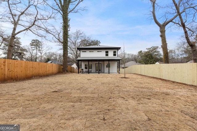 rear view of house with a patio