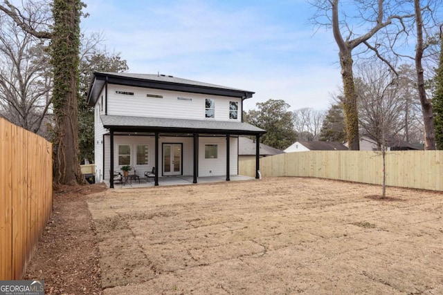 back of house featuring a patio area