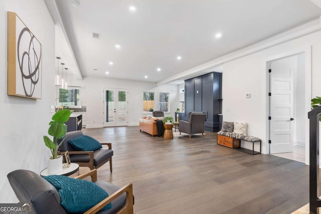 living room with hardwood / wood-style flooring and french doors