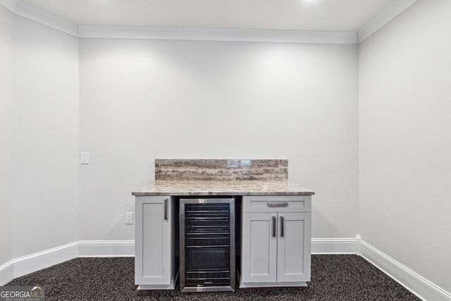 bar with ornamental molding and beverage cooler