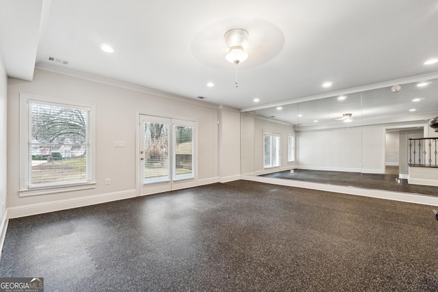 spare room featuring crown molding and ceiling fan