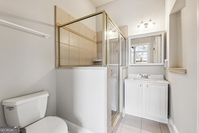 bathroom with walk in shower, tile patterned floors, vanity, and toilet