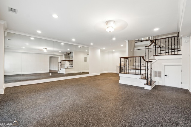 unfurnished living room featuring ornamental molding