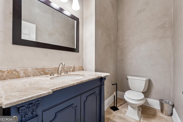 bathroom featuring vanity, toilet, and tile patterned flooring