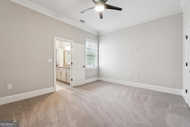 unfurnished bedroom featuring ornamental molding, light carpet, ceiling fan, and ensuite bath