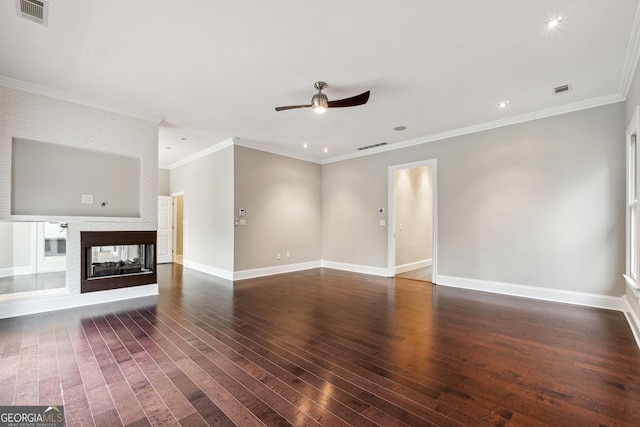 unfurnished living room featuring ornamental molding, dark hardwood / wood-style floors, ceiling fan, and a multi sided fireplace