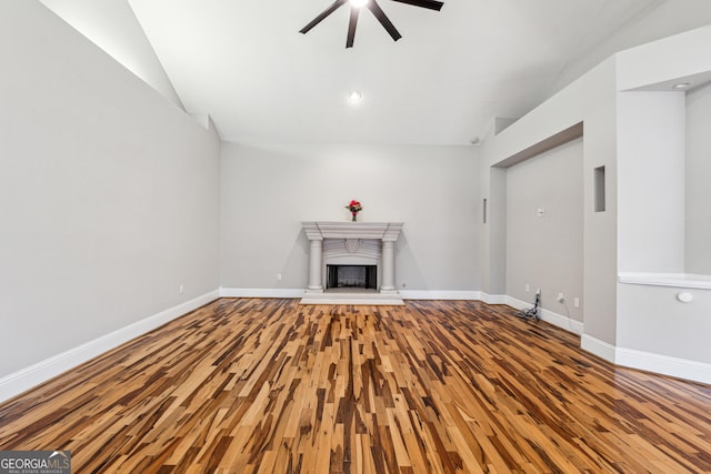 unfurnished living room with ceiling fan and hardwood / wood-style floors