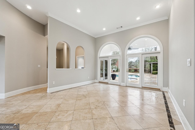 empty room featuring crown molding