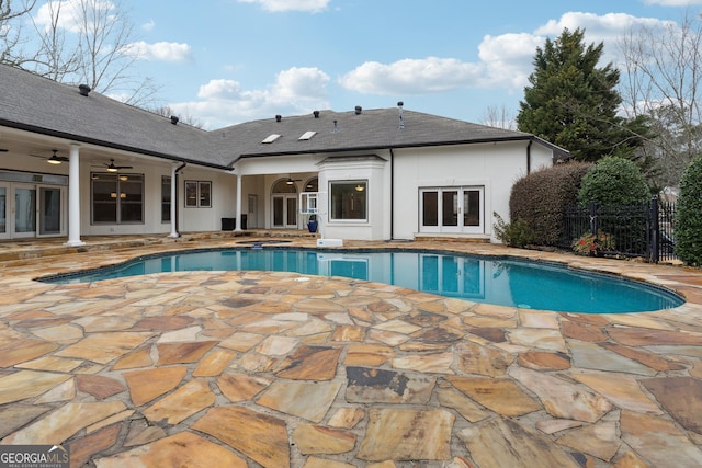 view of pool featuring a patio, ceiling fan, and french doors