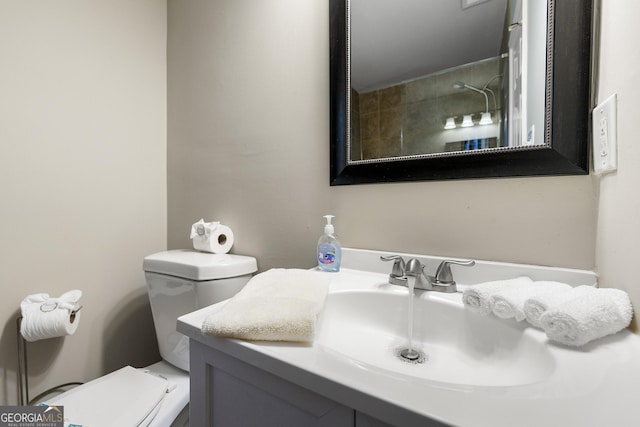 bathroom with toilet and vanity