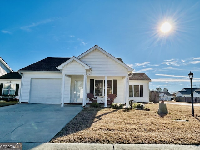 ranch-style house with a garage and a front lawn