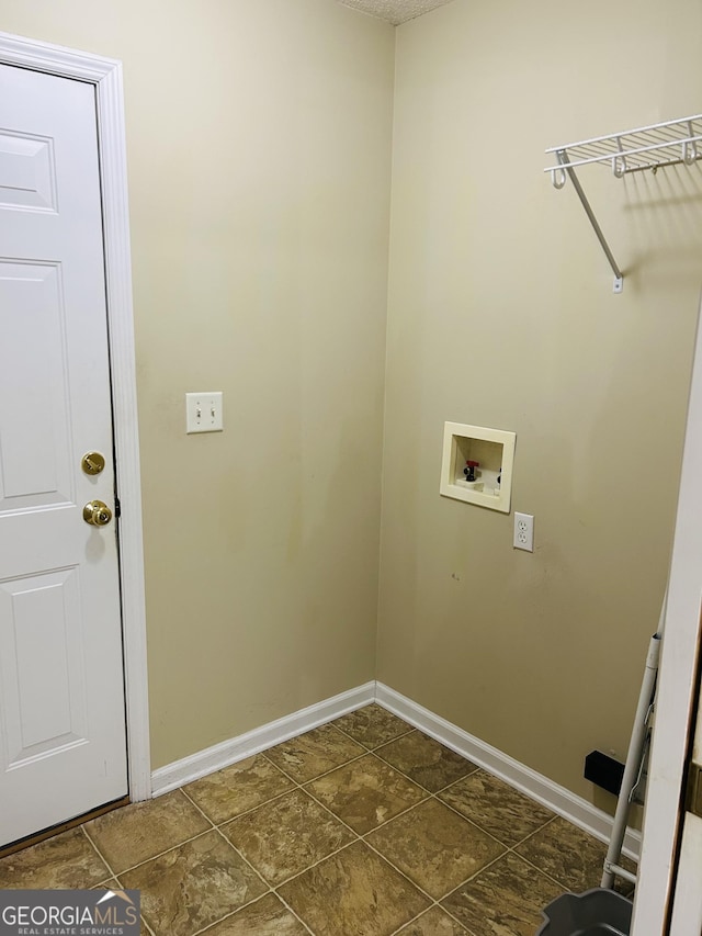 clothes washing area featuring hookup for a washing machine