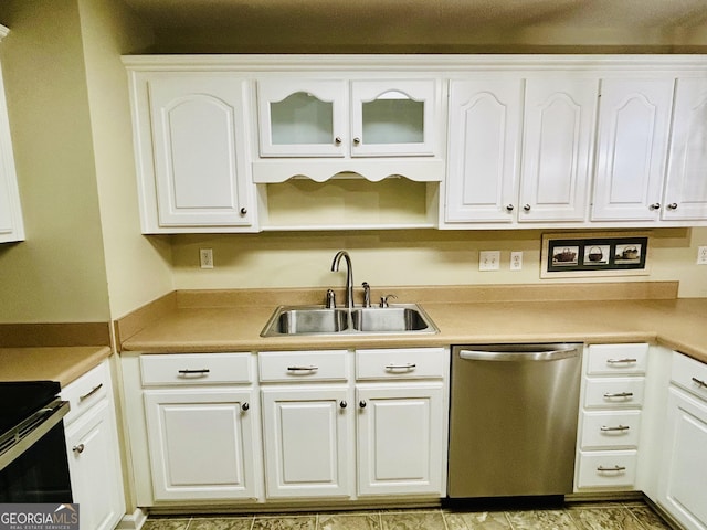 kitchen featuring sink, white cabinetry, dishwasher, and electric range