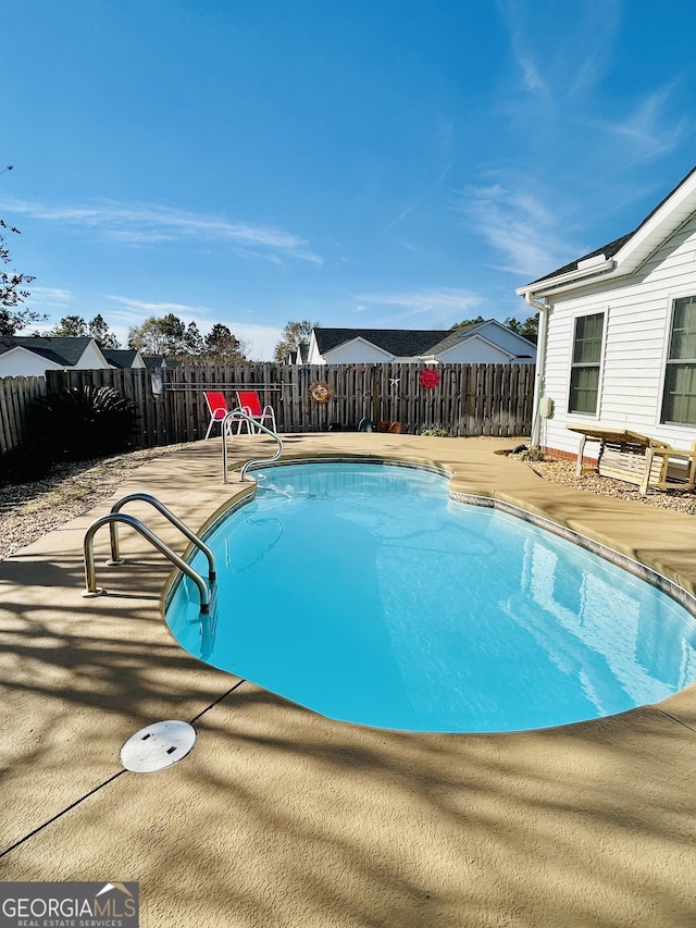 view of pool featuring a patio area