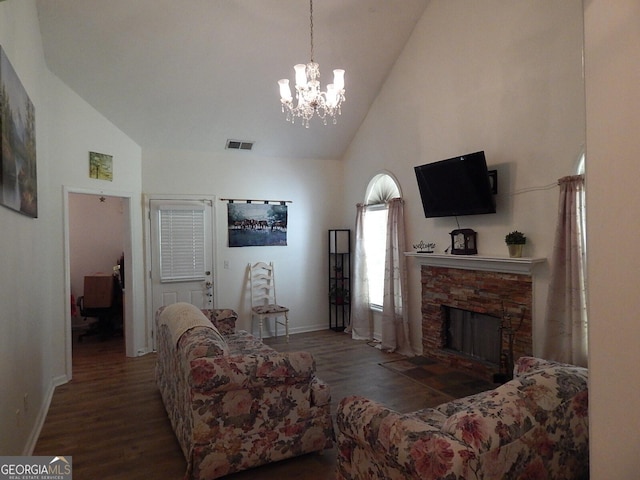 living room with a stone fireplace, dark wood-type flooring, and high vaulted ceiling