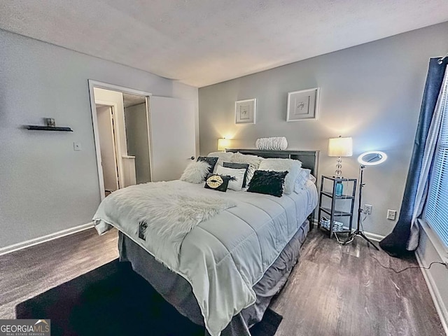 bedroom featuring wood-type flooring